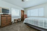 3rd bedroom upstairs features queen sized bed and tv